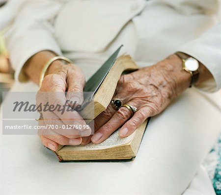 Close-up of Nun's Hands with Bible