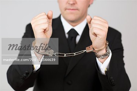 Businessman Wearing Handcuffs
