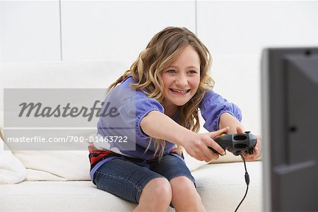 Playing video game Stock Photos, Royalty Free Playing video game