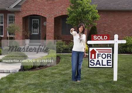 Portrait of Woman by Sold Sign