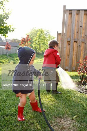 Boys Watering Garden