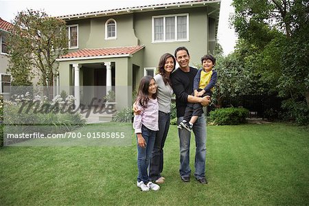 Portrait of Family in Front of House