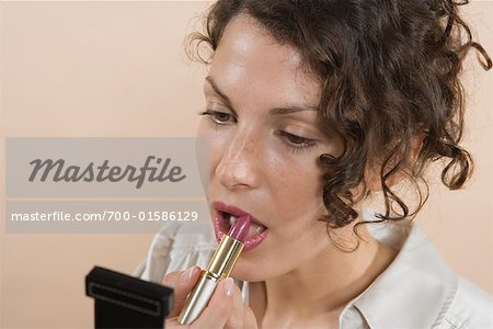 Woman Applying Lipstick
