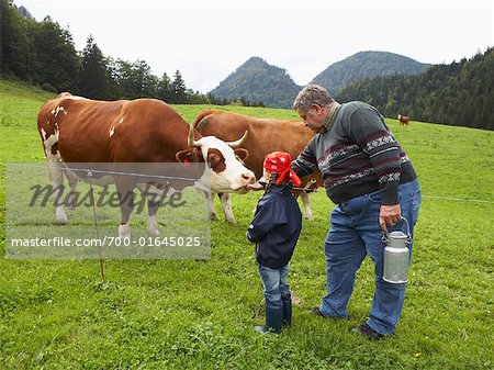 Man and Girl on Dairy Farm