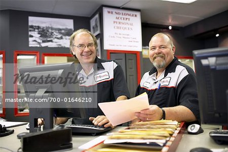 Portrait of Employees in Service Station