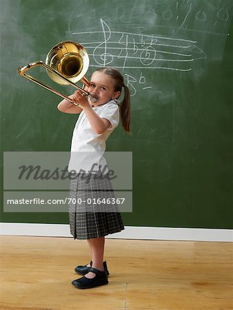 Girl in Classroom with Trombone