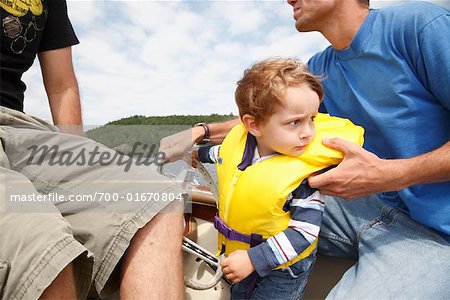 Boy on Boat with Adults
