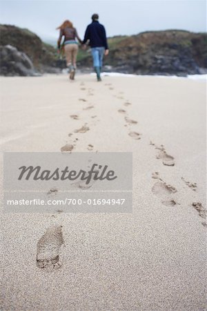 Couple Walking on Beach