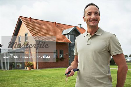Portrait of Man in Front of House