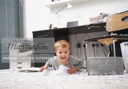 Boy Making Mess in Home Office