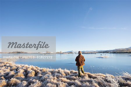 Man Standing by Frozen Lake, Rannoch Moor, Scotland