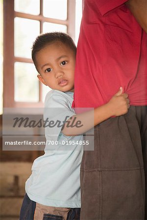 Boy Clinging to Dad's Leg