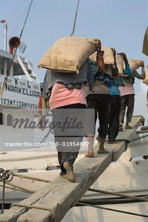 People Loading Cargo Onto Boat, Sunda Kelapa, North Jakarta, Jakarta, Java, Indonesia