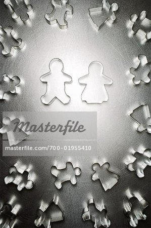 Gingerbread Man and Gingerbread Woman Cookie Cutter Couple, Surrounded by Others