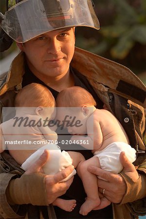 Firefighter Holding Babies