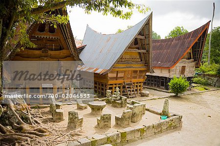 Stone Chairs and Table by Traditional Buildings, Lake Toba, Sumatra, Indonesia