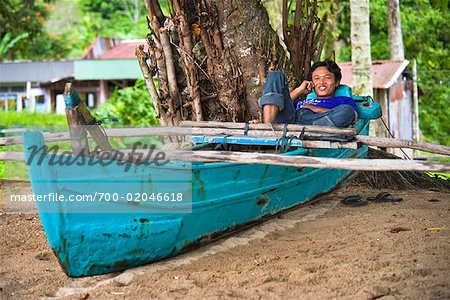 Fisherman with Cellular Phone, Bungus Bay, Sumatra, Indonesia