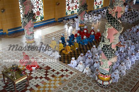 Worshippers in Cao Dai Temple, Vietnam