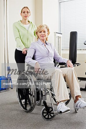 Physiotherapst with Woman in Wheelchair