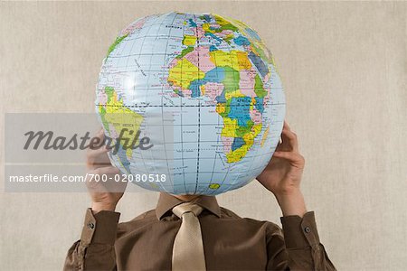 Businessman Holding Globe