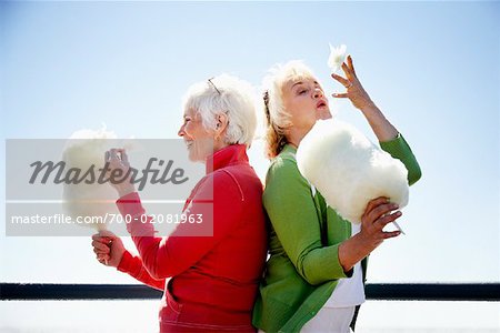 Women Eating Cotton Candy, Santa Monica Pier, Santa Monica, California, USA Women Eating Cotton Candy, Santa Monica Pier, Santa Monica, California, USA
