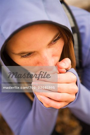 Woman Tring to Stay Warm while Hiking in the Sangre de Cristo Mountains, New Mexico, USA