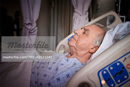 Man Sleeping in Hospital Bed