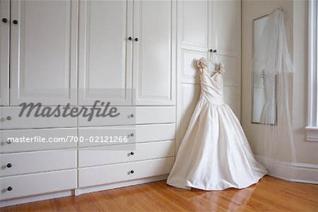 Wedding Dress Hanging on Closet Door