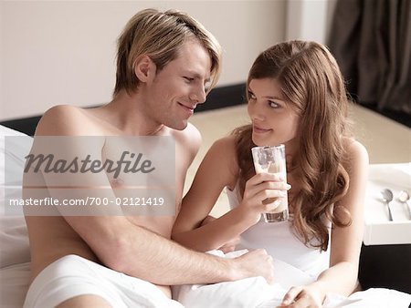 Couple Having Coffee in Bed