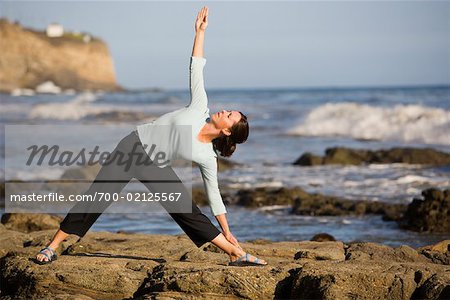 Women Doing Yoga Along Rocky Coast, Palos Verdes, California