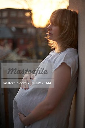 Portrait of Pregnant Woman at Sunrise