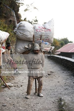 man with heavy load