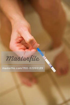 Woman Holding Pregnancy Test