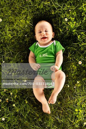 Portrait of Baby Lying on Grass Portrait of Baby Lying on Grass