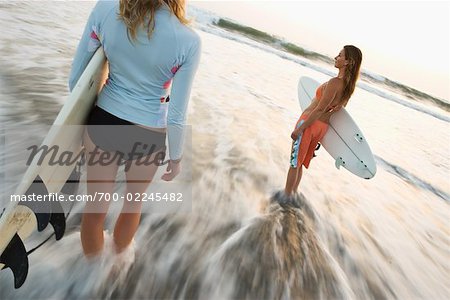 Surfers on the Beach at Sunset, Encinitas, San Diego County, California, USA