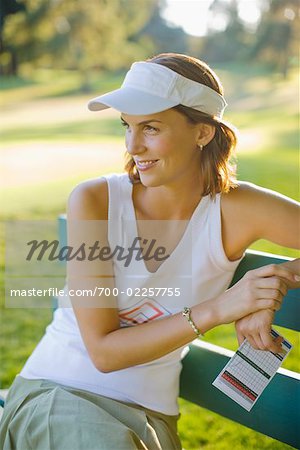 Woman Sitting on Bench, Taking a Break From Golfing, Salem, Oregon USA