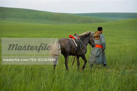 Horseman Walking with Horse, Inner Mongolia, China