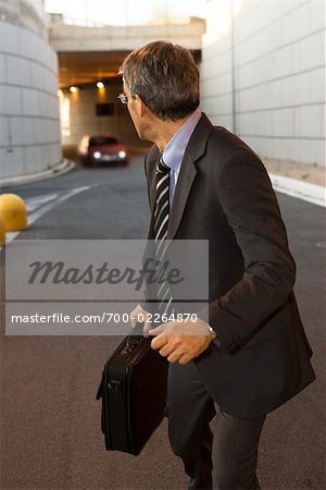 Businessman Running from Car