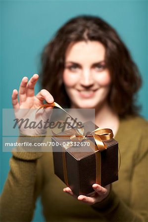 Woman Unwrapping Present