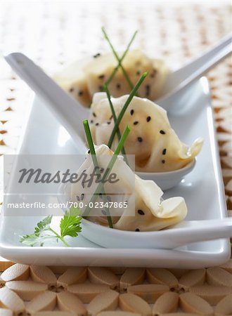 Chinese Dumplings With Toasted Sesame Seeds, Soy Sauce, and Chives