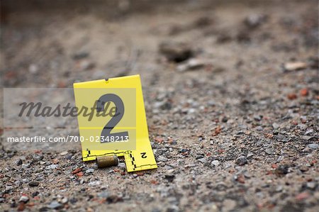 Crime scene investigation CSI evidence marker with empty, fired bullet  casings Stock Photo by ©shawn_hempel 317125746