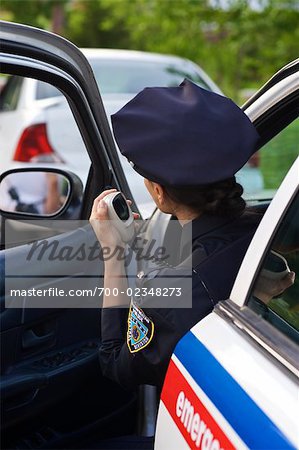 Police Woman in Cruiser at Side of Road, Toronto, Ontario, Canada