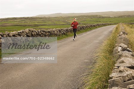 Woman Jogging in Inishmor, Aran Islands, County Galway, Ireland