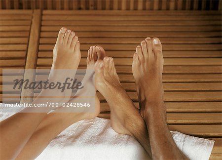 Couple's Feet on Towel in Spa