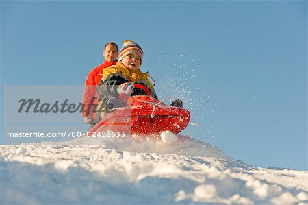 Father and Son Tobogganing, Salzburger Land, Austria