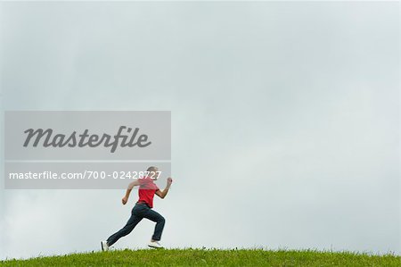 Man Running Across Field, Salzburger Land, Austria