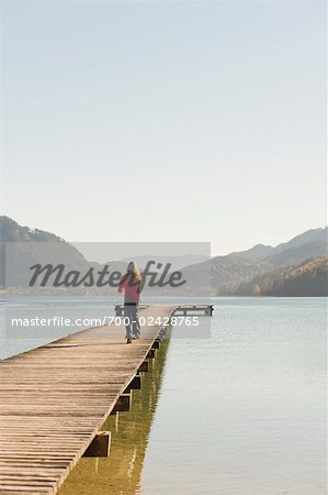 Woman Running on Dock, Fuschlsee, Fuschl am See, Salzkammergut, Salzburger Land, Austria