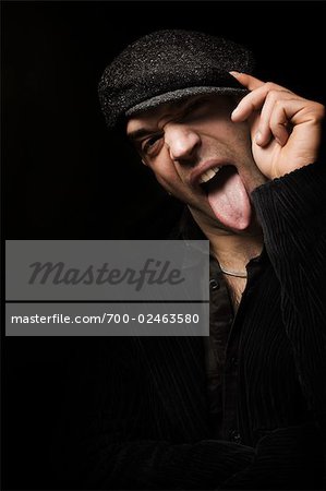 Portrait of Hip Hop Dancer Sticking Out His Tongue