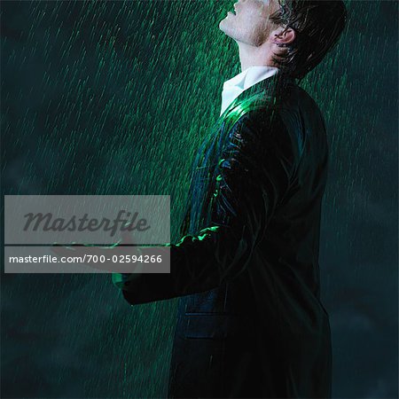 man standing in rain