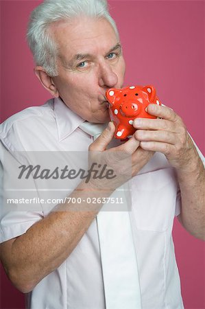 Man Kissing Piggy Bank